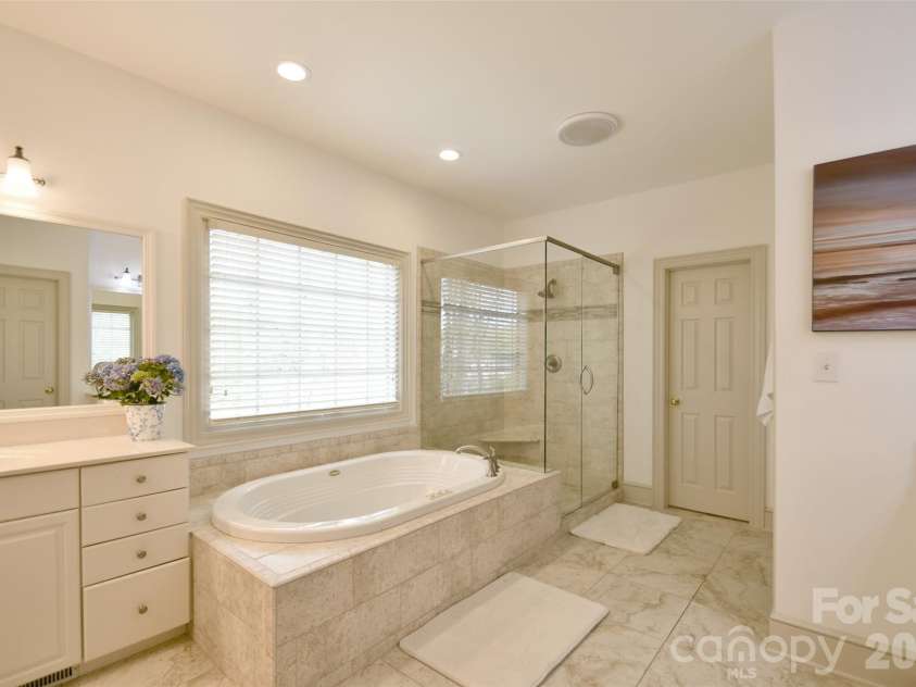 1320 Hudson Place, Davidson, NC 28036.  MLS# CAR4360257, YatesRealty ID 8419. Large tub and separate tiled shower