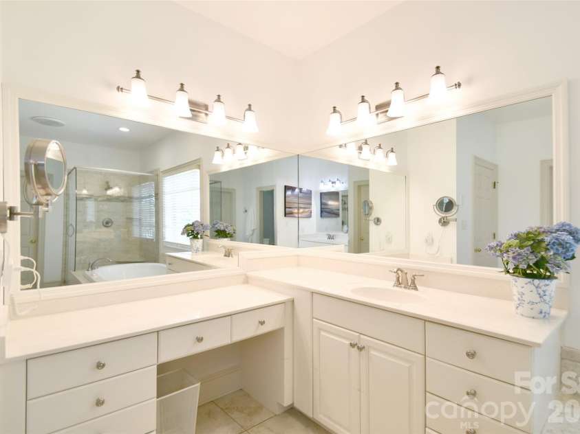 1320 Hudson Place, Davidson, NC 28036.  MLS# CAR4360257, YatesRealty ID 8419. Primary bathroom has dual vanities and a make-up area