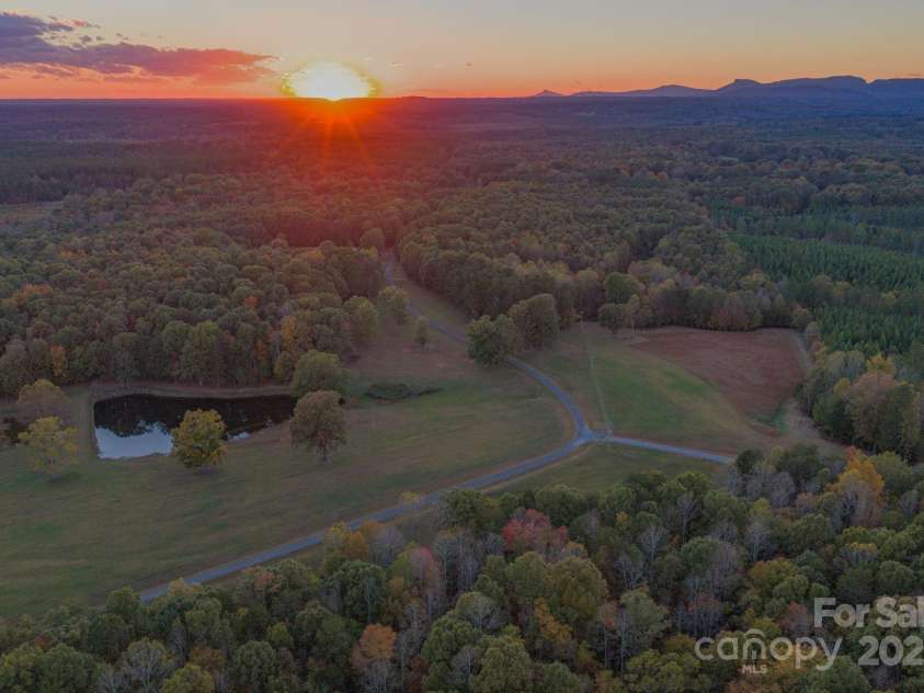 1260 Beaver Island Trail Road, Walnut Cove, NC 27052.  MLS# CAR4325171, YatesRealty ID 843. 3 stocked fishing ponds, open pasture land, and wooded areas