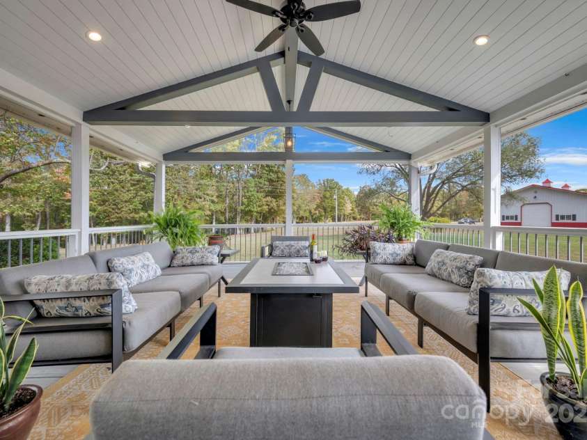 1260 Beaver Island Trail Road, Walnut Cove, NC 27052.  MLS# CAR4325171, YatesRealty ID 843. Large screen porch accessed from the deck and/or primary bedroom