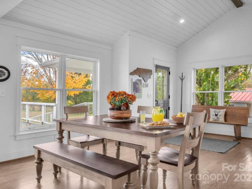 1260 Beaver Island Trail Road, Walnut Cove, NC 27052.  MLS# CAR4325171, YatesRealty ID 843. Open dining area adjacent to the kitchen & great room. Vaulted shiplap ceilings w/ exposed wood beams.