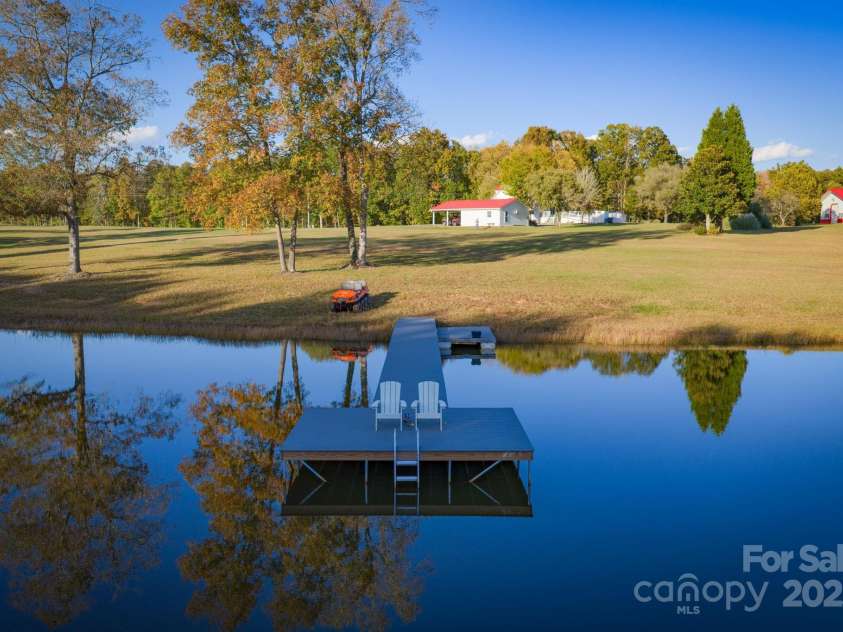 1260 Beaver Island Trail Road, Walnut Cove, NC 27052.  MLS# CAR4325171, YatesRealty ID 843. Stocked pond w/ floating dock