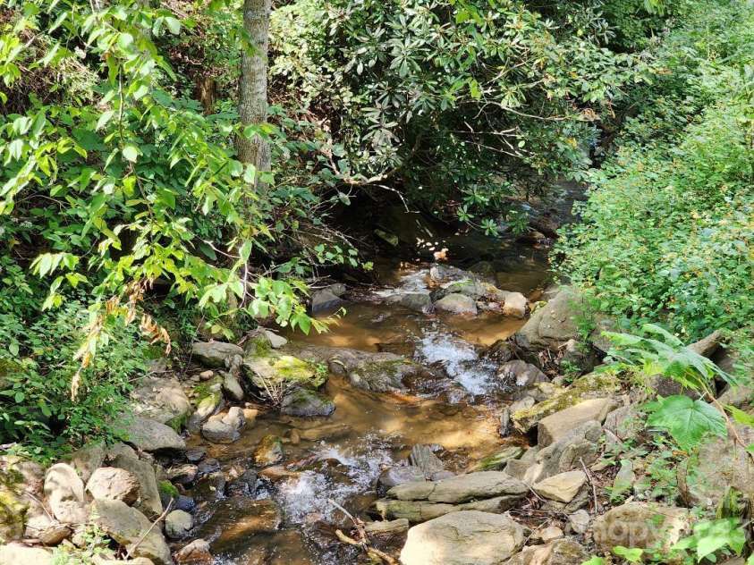160 Snake Den Drive, Burnsville, NC 28714.  MLS# CAR4062924, YatesRealty ID 843. Georges Fork Creek along property line.