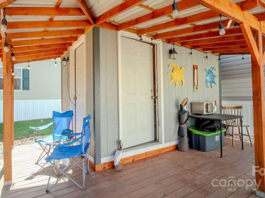 131 Pike Point, Waynesville, NC 28785.  MLS# CAR4224407, YatesRealty ID 8431. Covered porch on Shed