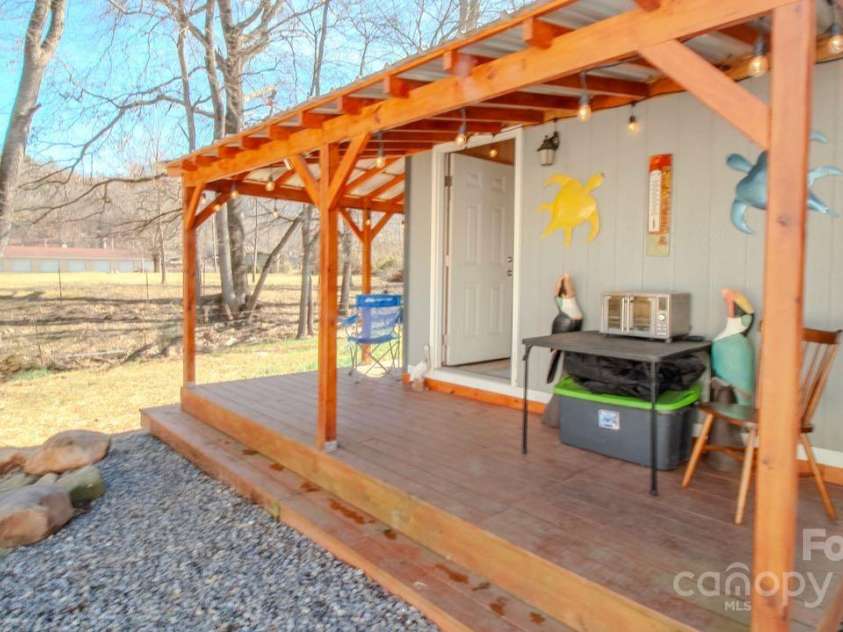 131 Pike Point, Waynesville, NC 28785.  MLS# CAR4224407, YatesRealty ID 8431. Shed and rear of property