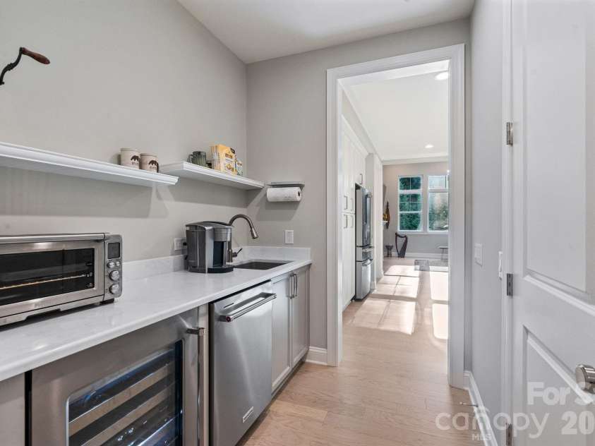 13212 Oak Farm Lane, Huntersville, NC 28078.  MLS# CAR4392191, YatesRealty ID 8431. A well-appointed scullery provides additional prep space, storage, a second dishwasher, wine refrigerator, and the perfect coffee station.