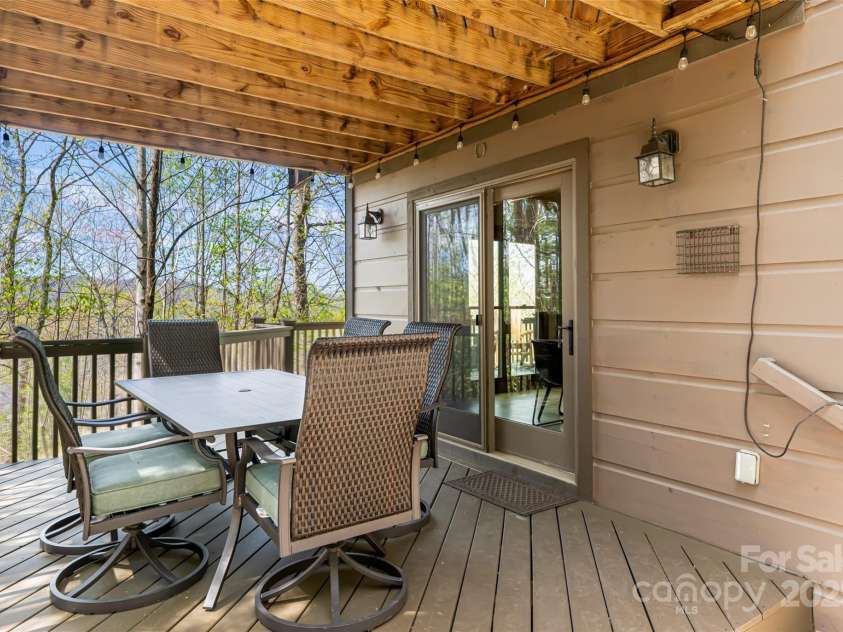 837 Peregrine Drive, Hendersonville, NC 28739.  MLS# CAR4250504, YatesRealty ID 8432. Covered lower patio