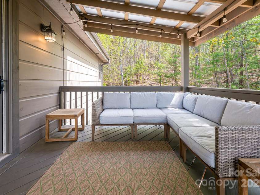 837 Peregrine Drive, Hendersonville, NC 28739.  MLS# CAR4250504, YatesRealty ID 8432. Upper level covered deck