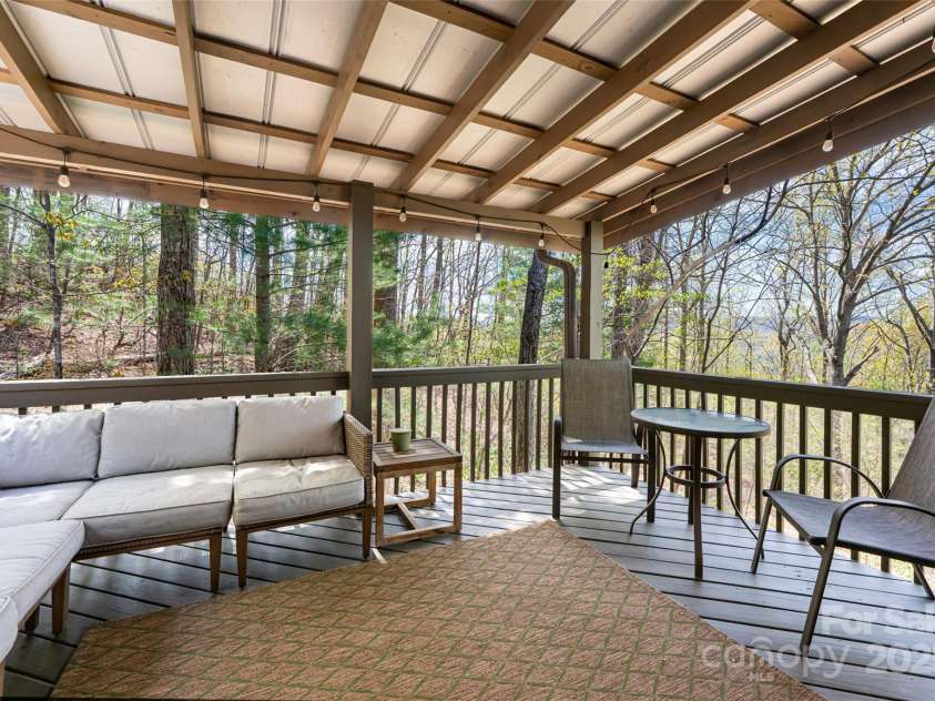 837 Peregrine Drive, Hendersonville, NC 28739.  MLS# CAR4250504, YatesRealty ID 8432. Upper level covered deck