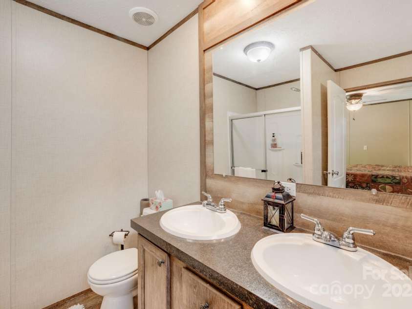 4825 Cane Creek Road, Bakersville, NC 28705.  MLS# CAR4248421, YatesRealty ID 8433. Primary ensuite
