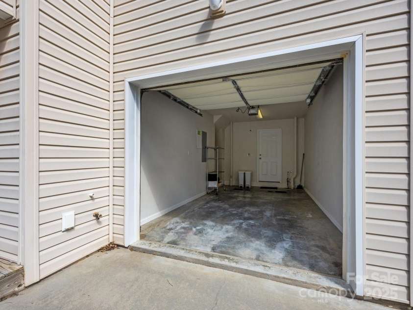 107 Alpine Ridge Drive, Asheville, NC 28803.  MLS# CAR4241586, YatesRealty ID 8436. One car garage that leads to the mudroom