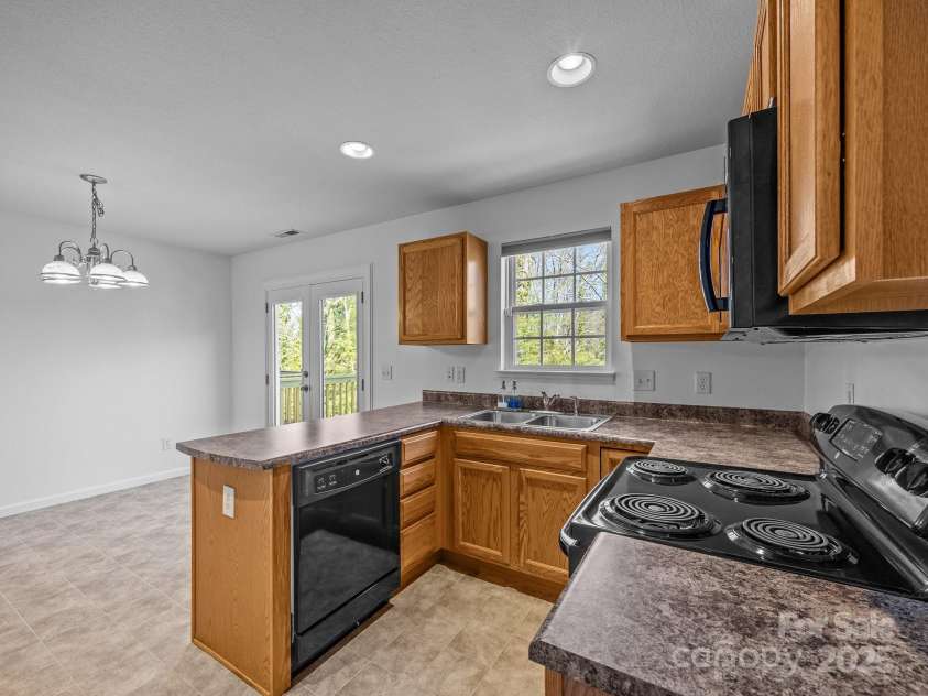 107 Alpine Ridge Drive, Asheville, NC 28803.  MLS# CAR4241586, YatesRealty ID 8436. U-shaped kitchen maximizes counter space