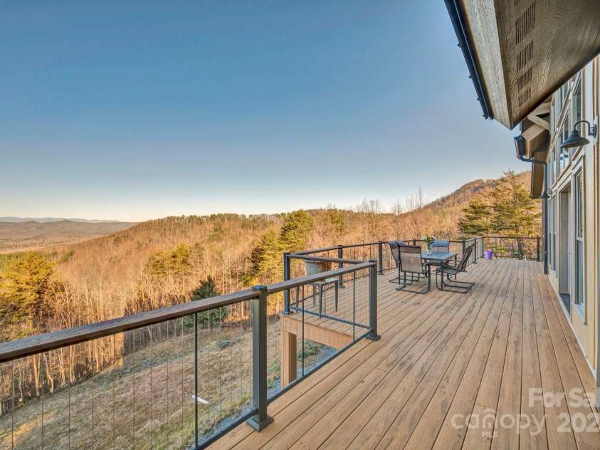 146 Sarinac Drive, Bostic, NC 28018.  MLS# CAR4327091, YatesRealty ID 844. An oversized back deck with cable railing and composite hand rail