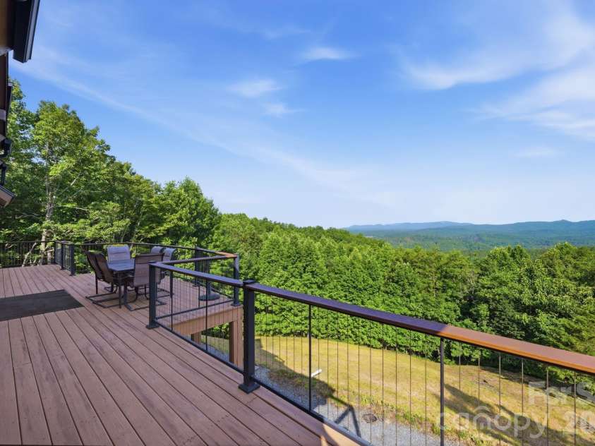 146 Sarinac Drive, Bostic, NC 28018.  MLS# CAR4327091, YatesRealty ID 844. Large deck with access from the great room, screen porch, and primary bedroom