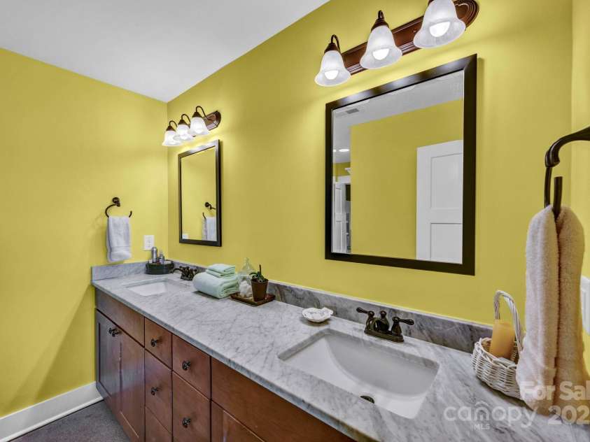 146 Sarinac Drive, Bostic, NC 28018.  MLS# CAR4327091, YatesRealty ID 844. Large shared bath with marble countertops and private tiled bath/shower combo