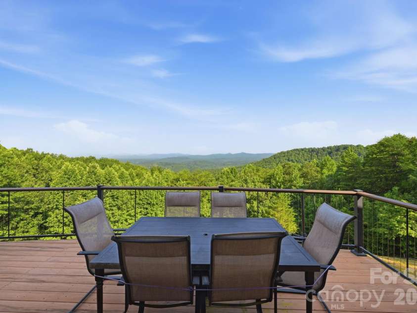 146 Sarinac Drive, Bostic, NC 28018.  MLS# CAR4327091, YatesRealty ID 844. Outdoor living includes an extra large back deck, screen porch, lower patio, fire pit, and welcoming front porch,