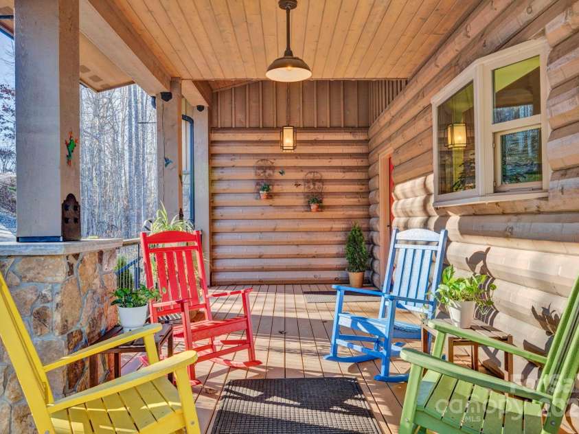 146 Sarinac Drive, Bostic, NC 28018.  MLS# CAR4327091, YatesRealty ID 844. Rocking chair wrap around porch welcomes guests to the front porch