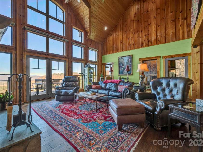 146 Sarinac Drive, Bostic, NC 28018.  MLS# CAR4327091, YatesRealty ID 844. Wall of windows bring the amazing mountain views inside