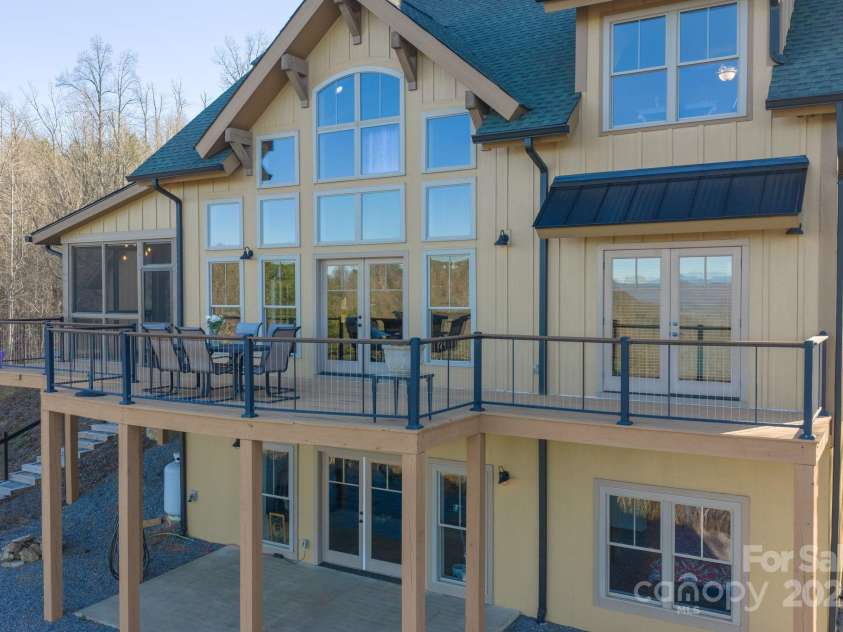 146 Sarinac Drive, Bostic, NC 28018.  MLS# CAR4327091, YatesRealty ID 844. Windows and cedar accents along the back of the house