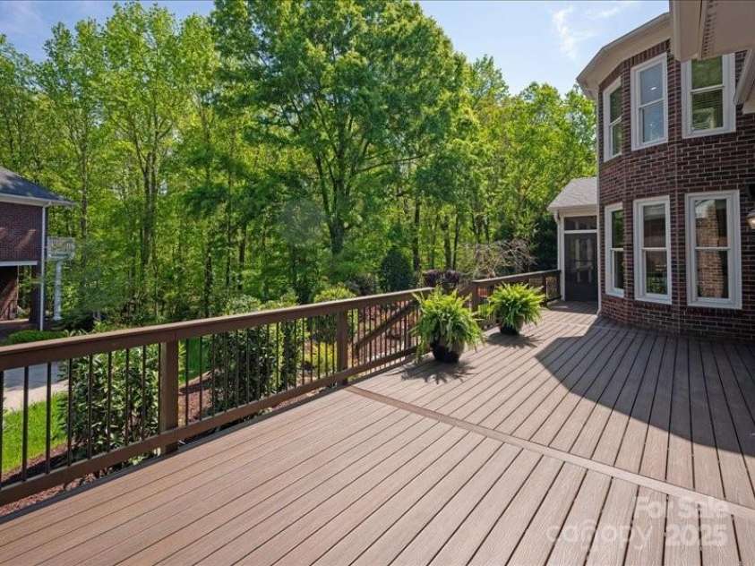 5809 Woodleigh Oaks Drive, Charlotte, NC 28226.  MLS# CAR4248176, YatesRealty ID 8441. Backyard deck off of Great Room