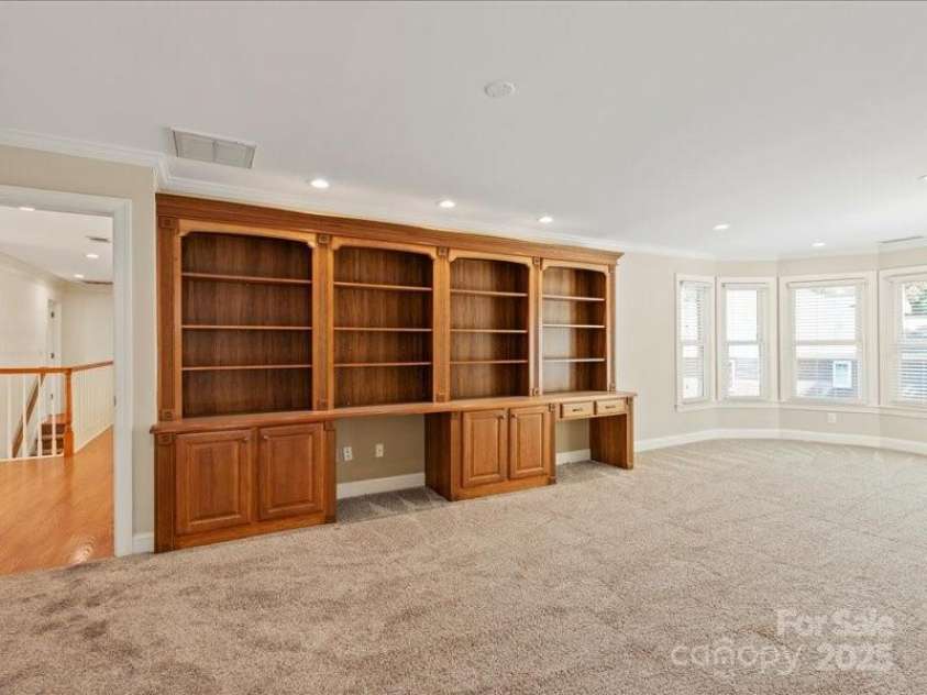 5809 Woodleigh Oaks Drive, Charlotte, NC 28226.  MLS# CAR4248176, YatesRealty ID 8441. Built-in Bookcase with incorporated desk space