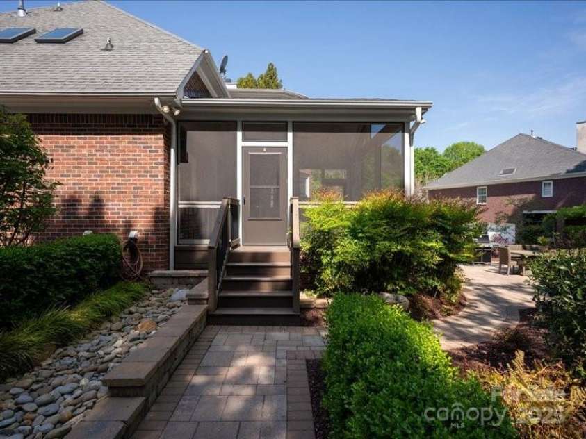 5809 Woodleigh Oaks Drive, Charlotte, NC 28226.  MLS# CAR4248176, YatesRealty ID 8441. Screened-in porch access into backyard