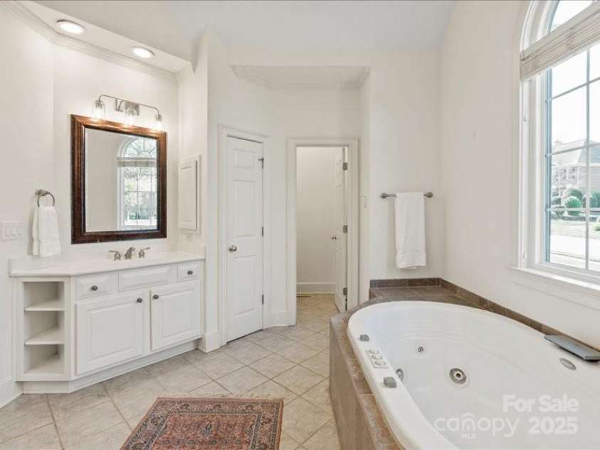 5809 Woodleigh Oaks Drive, Charlotte, NC 28226.  MLS# CAR4248176, YatesRealty ID 8441. ...with dual vanities and separate watercloset