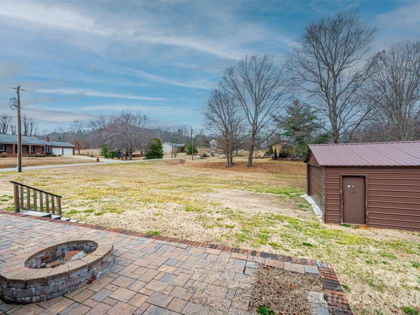 7141 Knobs Landing, Connelly Springs, NC 28612.  MLS# CAR4353694, YatesRealty ID 8442. View of backyard from fire pit