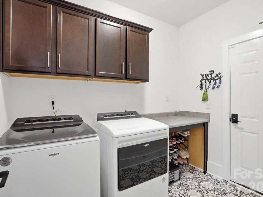 1342 Links Crossing Drive, Monroe, NC 28112.  MLS# CAR4341634, YatesRealty ID 8443. Laundry Room with Storage