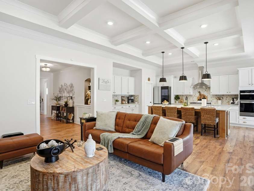1342 Links Crossing Drive, Monroe, NC 28112.  MLS# CAR4341634, YatesRealty ID 8443. Living room flows into the chef's kitchen