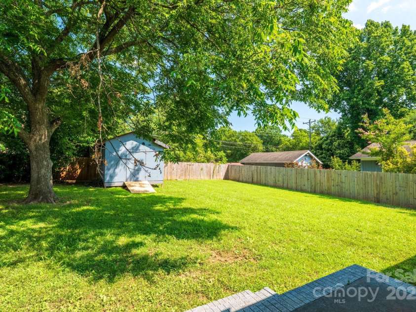 4930 Crestmont Drive, Charlotte, NC 28205.  MLS# CAR4276019, YatesRealty ID 8443. Storage Shed and fully fenced back yard