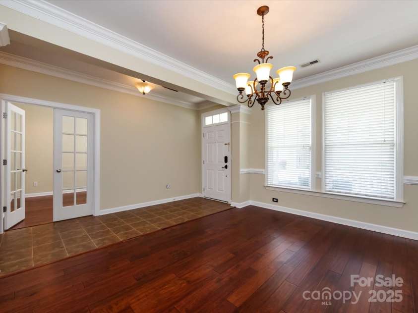 8830 Beaver Creek Drive, Charlotte, NC 28269.  MLS# CAR4233307, YatesRealty ID 8449. Entry area and dining room