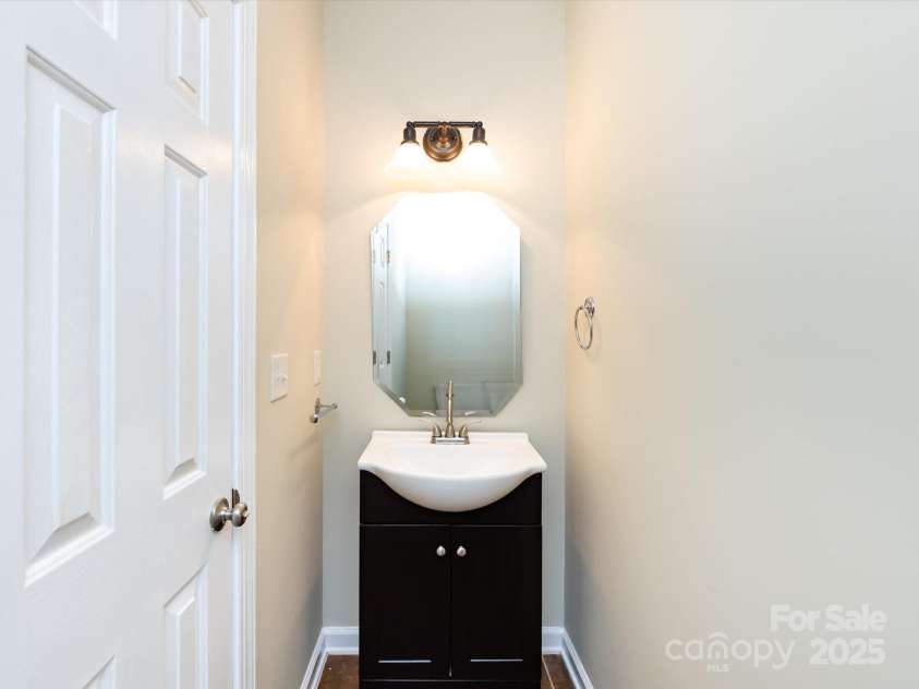 8830 Beaver Creek Drive, Charlotte, NC 28269.  MLS# CAR4233307, YatesRealty ID 8449. Half bath downstairs