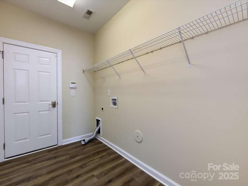 8830 Beaver Creek Drive, Charlotte, NC 28269.  MLS# CAR4233307, YatesRealty ID 8449. Laundry room and door to garage