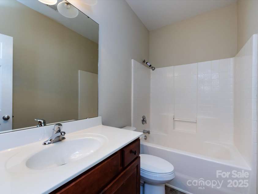 8830 Beaver Creek Drive, Charlotte, NC 28269.  MLS# CAR4233307, YatesRealty ID 8449. Upstairs bathroom