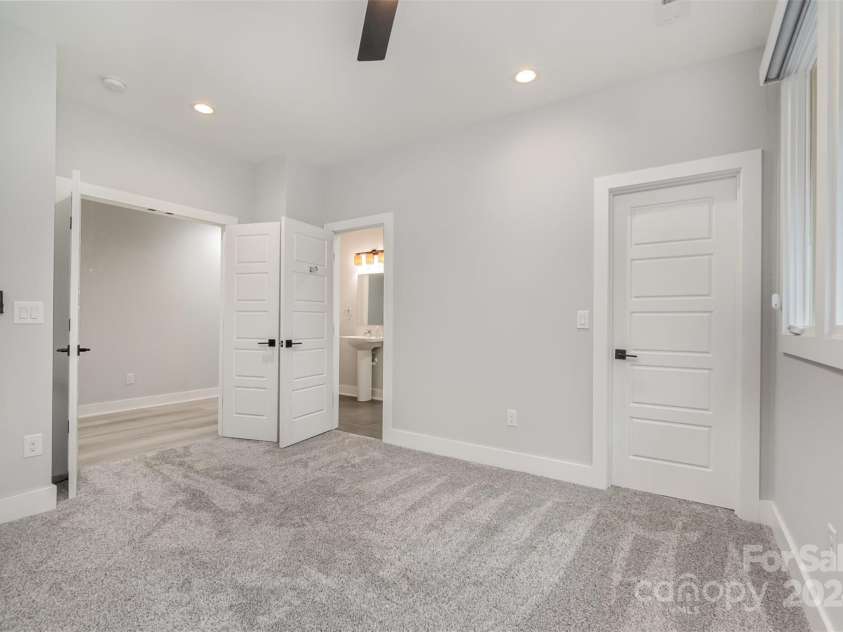 21205 Olde Quarry Lane, Cornelius, NC 28031.  MLS# CAR4198021, YatesRealty ID 8450. Upstairs bedroom number three with en suite bathroom.