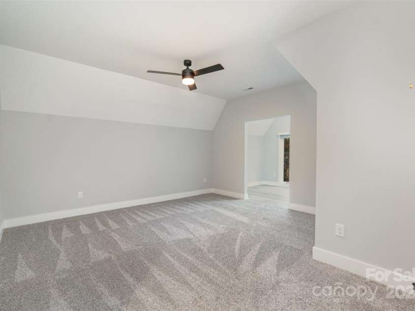 21205 Olde Quarry Lane, Cornelius, NC 28031.  MLS# CAR4198021, YatesRealty ID 8450. Upstairs large bedroom number two with jack and jill bathroom and flex/office space.