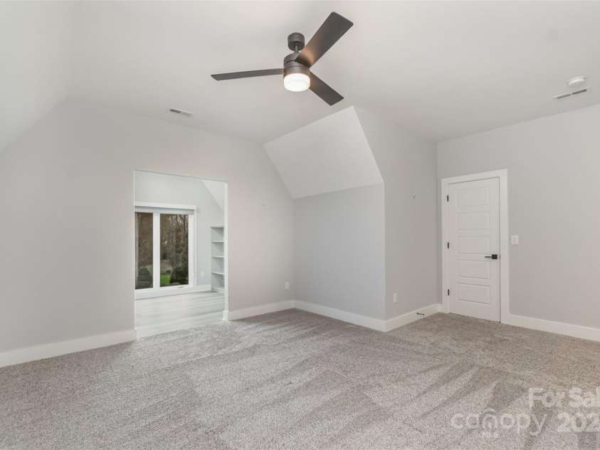21205 Olde Quarry Lane, Cornelius, NC 28031.  MLS# CAR4198021, YatesRealty ID 8450. Upstairs large bedroom number two with jack and jill bathroom and flex/office space.
