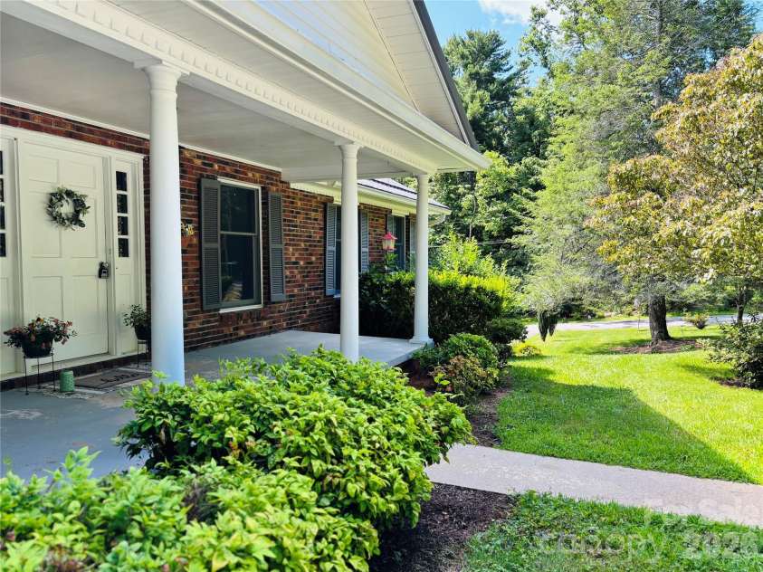 328 Melody Lane, Saluda, NC 28773.  MLS# CAR4282842, YatesRealty ID 8455. Front porch