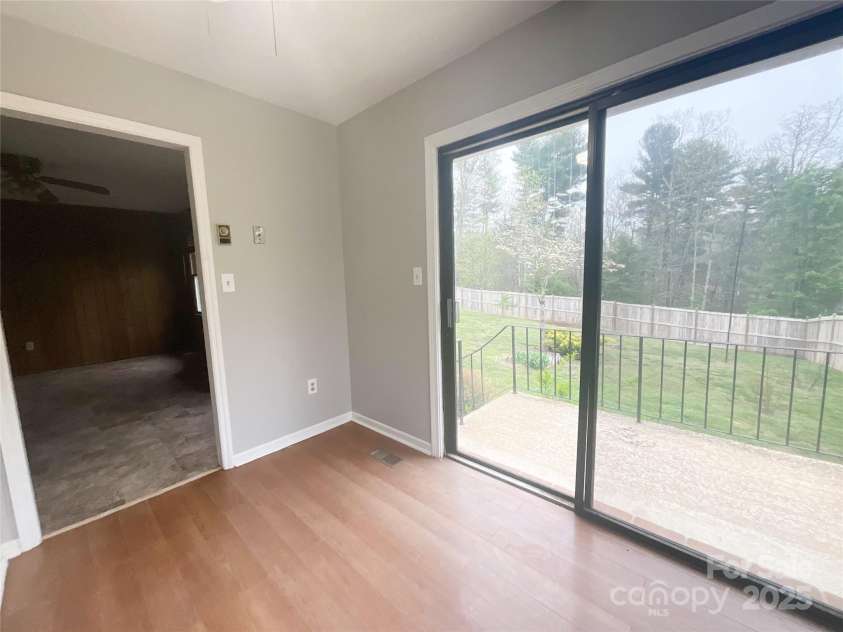 328 Melody Lane, Saluda, NC 28773.  MLS# CAR4282842, YatesRealty ID 8455. Kitchen going out to back yard