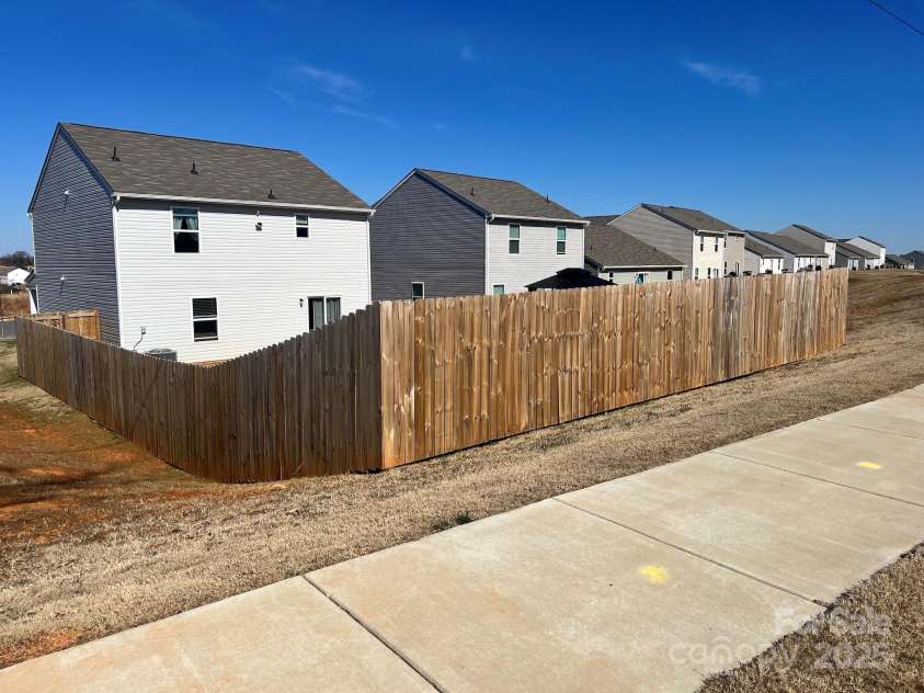 329 Aniston Lane, Shelby, NC 28152.  MLS# CAR4225961, YatesRealty ID 8457. Back Yard Including Fence and Sidewalk View