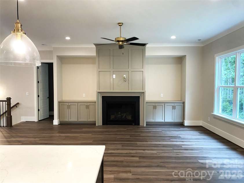 183 Chaska Loop, Troutman, NC 28166.  MLS# CAR4364790, YatesRealty ID 8461. Great Room- Fireplace & Built-ins
