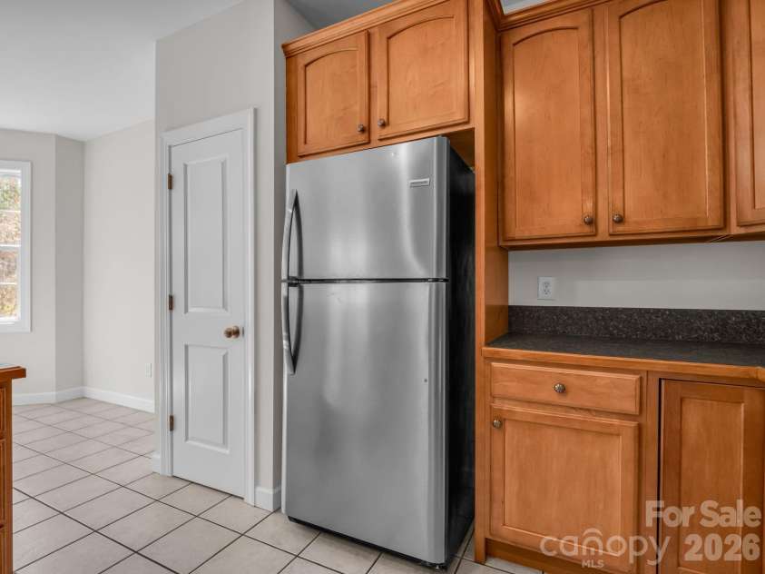 7 Saint Andrews Road, Arden, NC 28704.  MLS# CAR4304401, YatesRealty ID 8462. Kitchen has pantry closet.