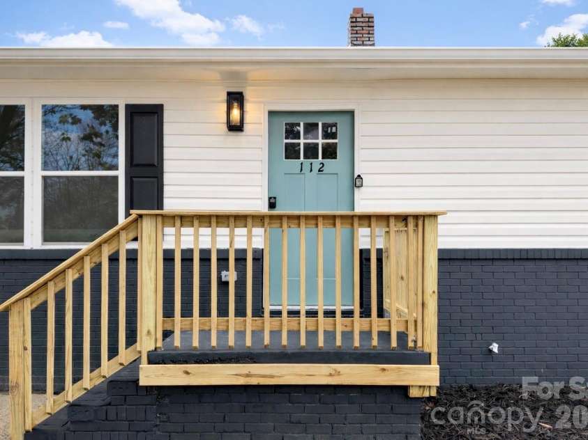112 Harmony Trail, Gastonia, NC 28056.  MLS# CAR4350947, YatesRealty ID 8467. Inviting front entry with new wood railing and modern door