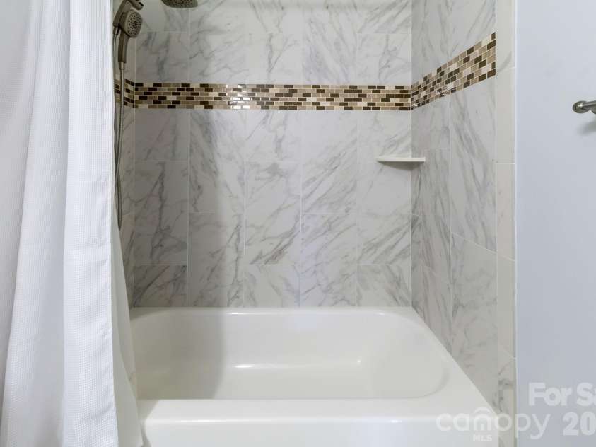 3310 Arbor Pointe Drive, Indian Trail, NC 28079.  MLS# CAR4351300, YatesRealty ID 8468. Floor to ceiling tile shower