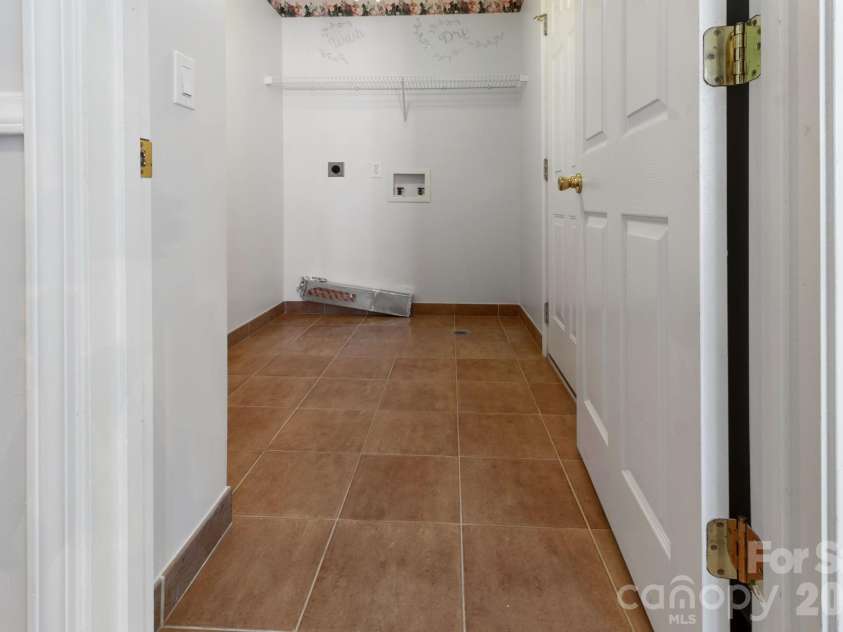 3310 Arbor Pointe Drive, Indian Trail, NC 28079.  MLS# CAR4351300, YatesRealty ID 8468. Upstairs spacious laundry room.