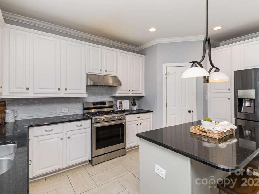 502 Geary Street, Concord, NC 28027.  MLS# CAR4238794, YatesRealty ID 8479. Gas stove/vented hood, island