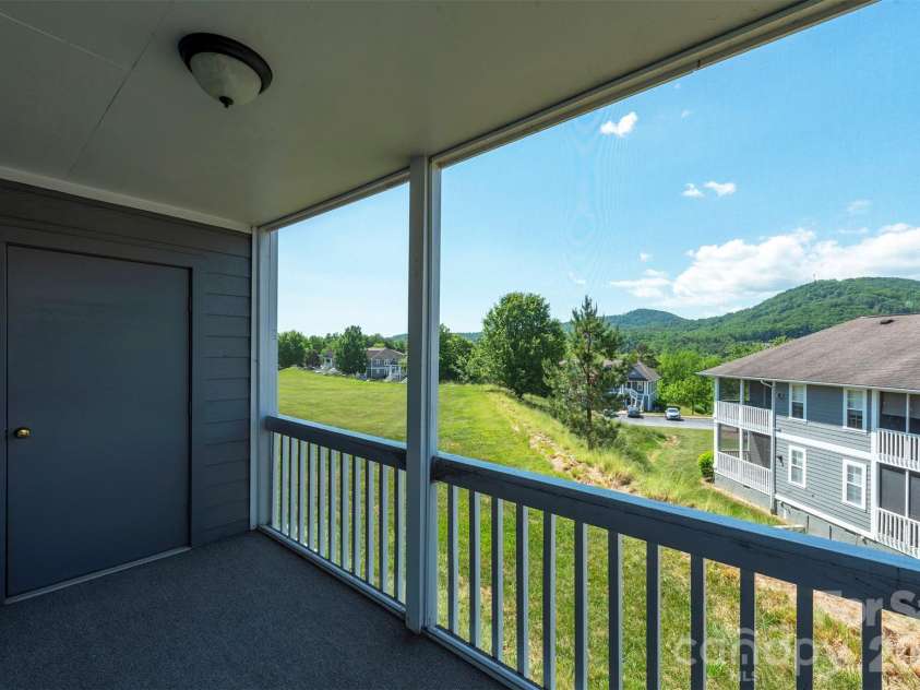 4805 Breakers Lane, Asheville, NC 28806.  MLS# CAR4376162, YatesRealty ID 848. The relaxing place with a view, your screened back porch.