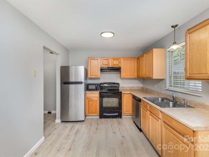 7507 Holly Grove Court, Charlotte, NC 28227.  MLS# CAR4246901, YatesRealty ID 8480. Kitchen - Laundry Room to the left