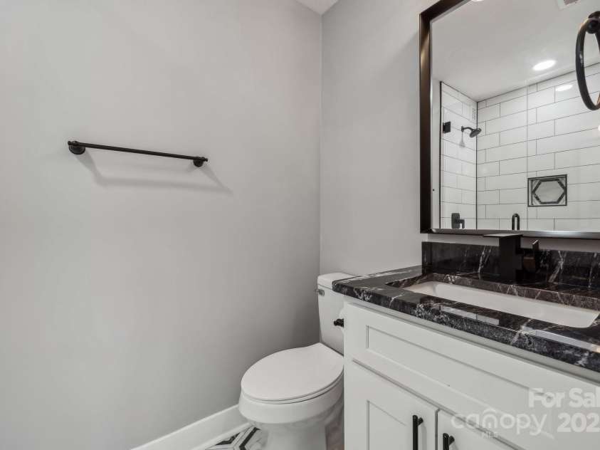 500 Dedmon Drive, Charlotte, NC 28216.  MLS# CAR4247974, YatesRealty ID 8486. 2nd Full Bathroom w/ Frameless, tiled Shower